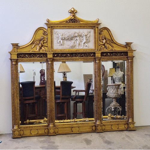 2 - A superb and imposing three-section plate mirror glass overmantel, having gilt frame, inset cherub f... 