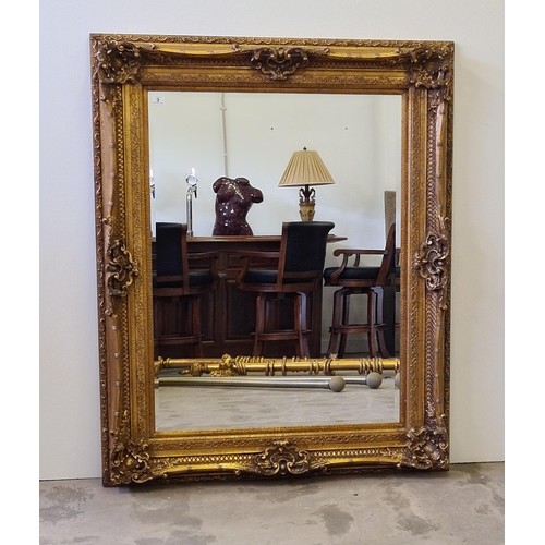 3 - A large French style bevel edged mirror in gilt frame measuring 159 (h) x 129 (w) cm.