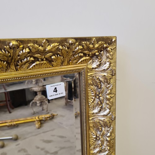 4 - A large bevelled edge wall mirror in gilt frame measuring 116 (h) x 145 (w) cm.