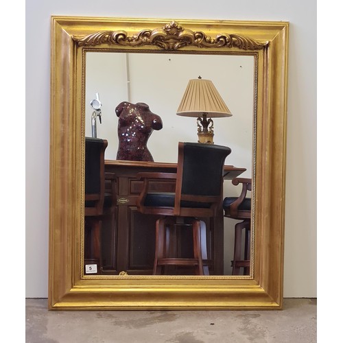 5 - A large gilt framed mirror measuring 107 (h) x 87 (w) cm.