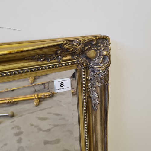 8 - A large French style bevel edged mirror in gilt frame measuring 132 (h) x 106 (w) cm.