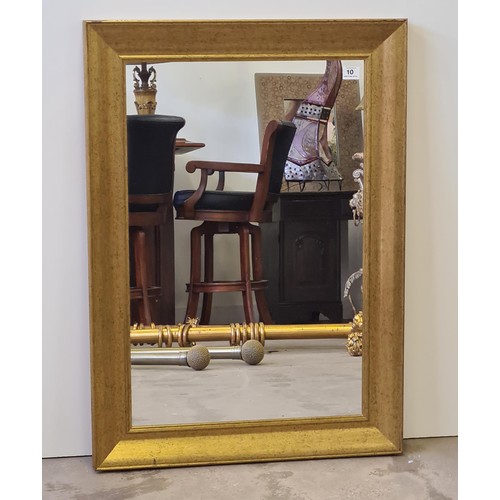 10 - A tall gilt framed and bevelled edge mirror of French style measuring 148 (h) x 85 (w) cm.