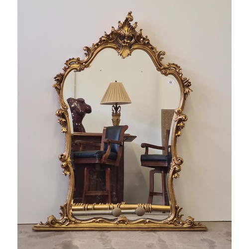 12 - Rococo style gilt frame overmantel. 145 (h) x 118 (w) cm.