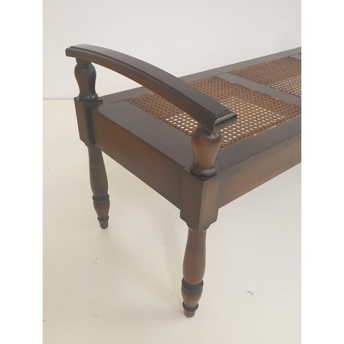 17 - Mahogany and cane bench, having 3 inset split-cane bergère seats in mahogany frame and raised on tur... 