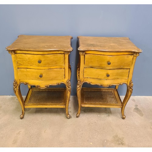 20 - A pair of Louis XVI style nightstands. Each having two drawers over inset split cane cane shelf belo... 