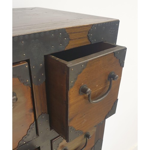 21 - An Oriental origin twenty-four drawer apothecary chest measuring 135 (h) x 79 (w) x 35 (d) cm.