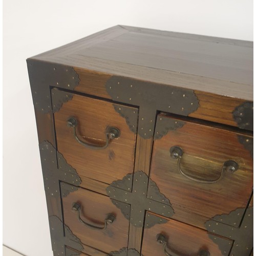 21 - An Oriental origin twenty-four drawer apothecary chest measuring 135 (h) x 79 (w) x 35 (d) cm.