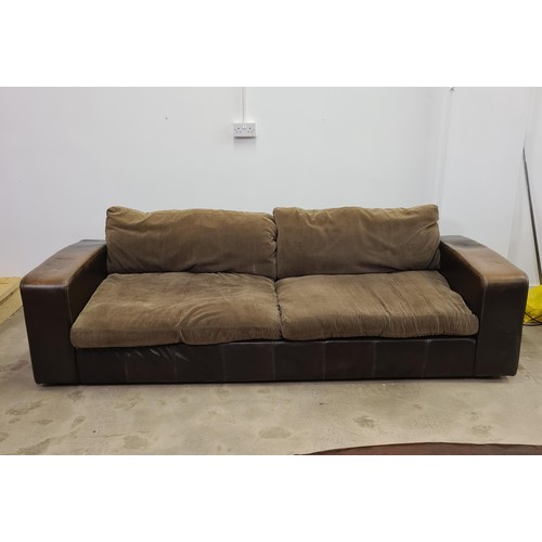 27 - A large brown leather four-seater sofa with loose corduroy seats and back supports. 45 (floor to sea... 