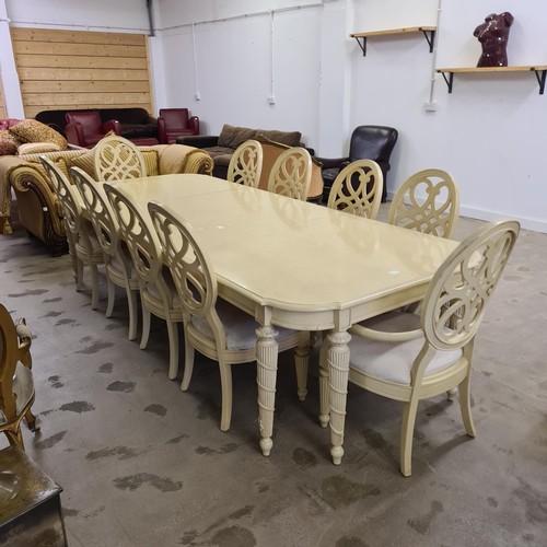 36 - A splendid French style extending dining table and 10 dining chairs, two of which being carvers.&nbs... 