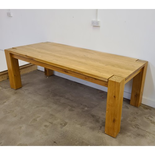 38 - A substantial oak dining table 75 (h) x 220 (w) x 101 (d) cm.