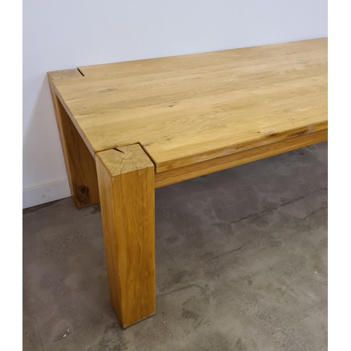 38 - A substantial oak dining table 75 (h) x 220 (w) x 101 (d) cm.