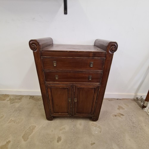 45 - An Oriental scroll-top cabinet.