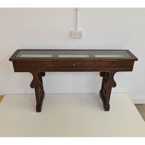 25 - A three-drawer mahogany bijouterie table. 82 (h) x 155 (w) x 34 (d) cm.