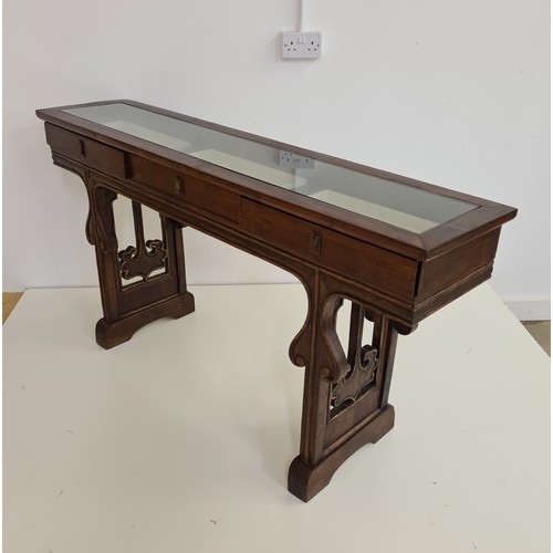 25 - A three-drawer mahogany bijouterie table. 82 (h) x 155 (w) x 34 (d) cm.