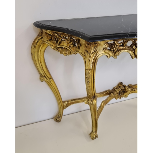 51 - Louis XV style demi lune table having black marble top raised on gilt frame. 82 (h) x 128 (w) c... 