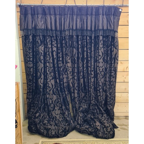 79 - A good pair of heavyweight lined curtains with beaded valance, 290 (drop) x 332 (w) cm.