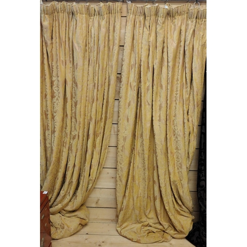 86 - Pair of fully lined gold curtains and swags. 275 (drop) x 240 (w).