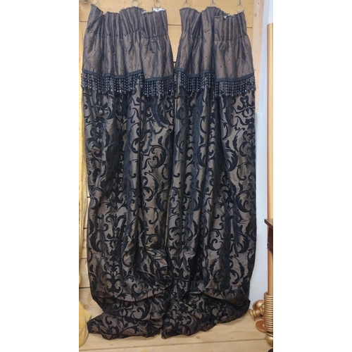 87 - Pair of fully lined black curtains with beaded valance, 280 (drop) x 190 (w).