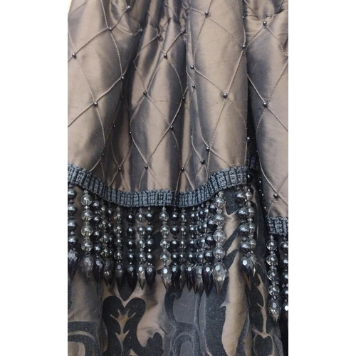 87 - Pair of fully lined black curtains with beaded valance, 280 (drop) x 190 (w).