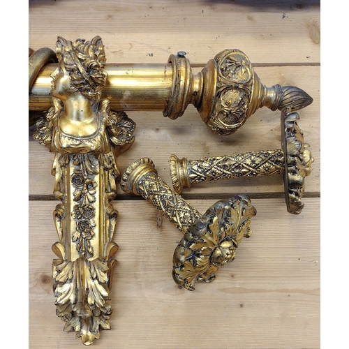 103 - Rococo style curtain pole in gilt finish with holdbacks. 213 cm in length.