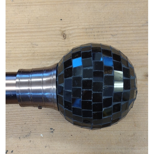 104 - Brushed metal curtain pole with mosaic globe finials. 260 cm in length. 