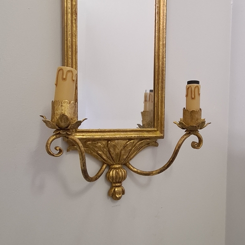 132 - A pair of twin-arm mirrored wall sconces. 65 (h) x 28 (w)