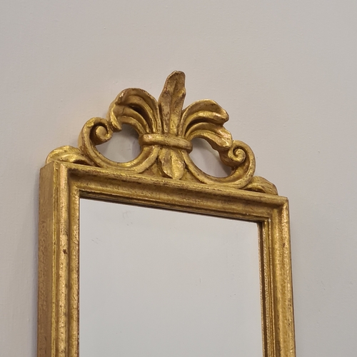 132 - A pair of twin-arm mirrored wall sconces. 65 (h) x 28 (w)