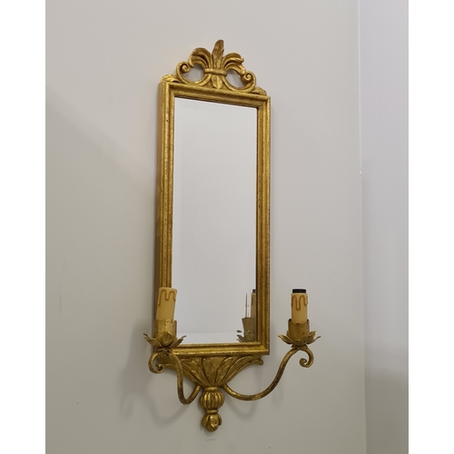 132 - A pair of twin-arm mirrored wall sconces. 65 (h) x 28 (w)