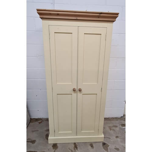 133 - A painted pine wardrobe measuring 199 (h) 98 (w) x 69 (d) cm.