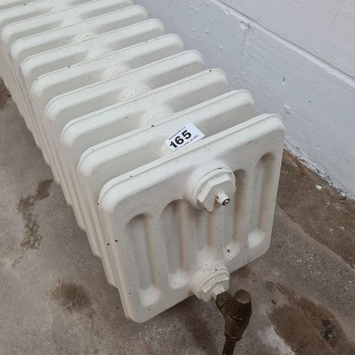 165 - A 44 section cast iron radiator. 36 (h) x 282 (w) x 25 (d) cm.