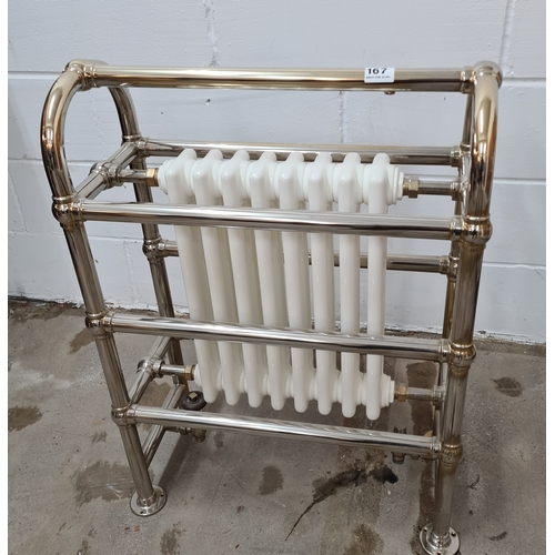 167 - Cast iron and polished chrome towel radiator. 87 (h) x 63 (w) x 30 (d).