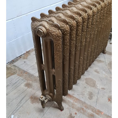 181 - A Rococo style, 2 column, 14 section cast iron radiator in antiqued finish. Standing 75 (h) x 125 (w... 