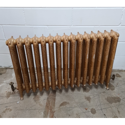 182 - A Rococo style, 2 column, 15 section cast iron radiator in antiqued finish. Standing 75 (h) x 130 (w... 