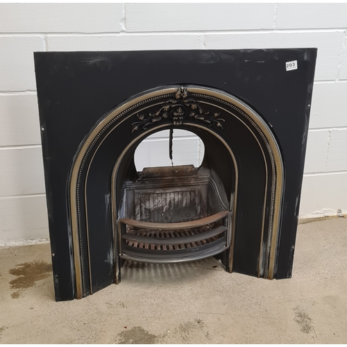 203 - An antique cast iron fireplace. 96 (h) x 96 (w) x 31 (d).