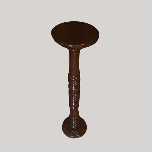 131 - A nicely carved mahogany torchere standing 101 cm in height.