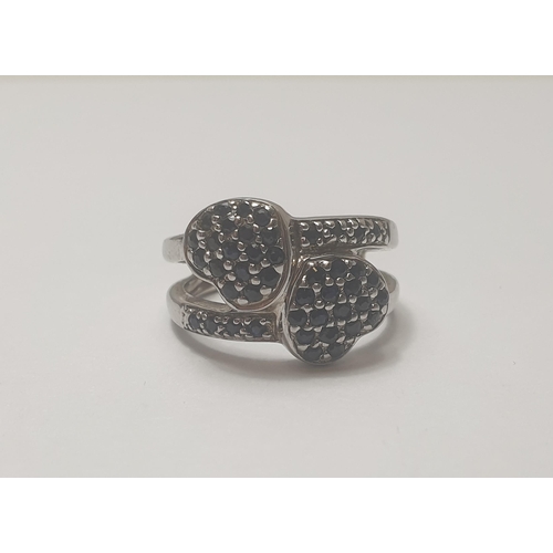 256 - 925 silver entwined heart and black stone set ring. Size N. Shipping Group (A).