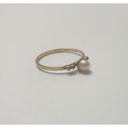 259 - Pearl set gold coloured metal ring, size L. Shipping Group (A).