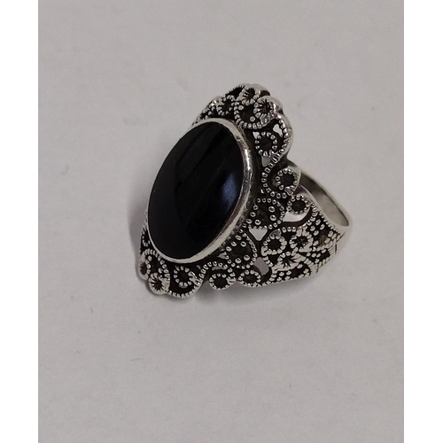 273 - 925 silver and black onyx set ring, size P½. Shipping Group (A).
