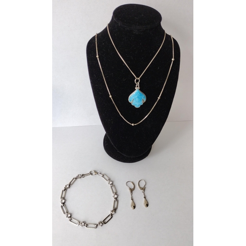 283 - 925 silver jewellery lot comprising two necklaces, enameled pendant, bracelet and earrings. Shipping... 