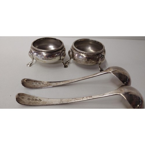 293A - A pair of Georgian silver sauce ladles and a pair of silver salts (hallmarks rubbed). Shipping Group... 