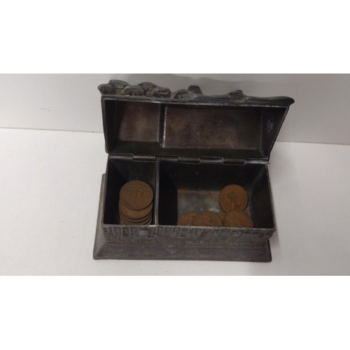 296 - A heavy pewter money box in the form of 'Anne Hathaways cottage' containing some UK copper coinage. ... 