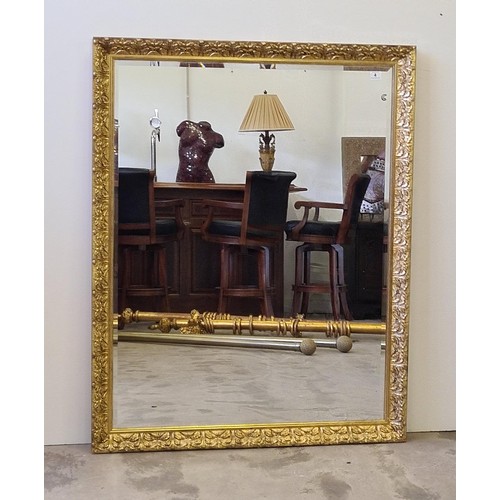 4 - A large bevelled edge wall mirror in gilt frame measuring 116 (h) x 145 (w) cm.