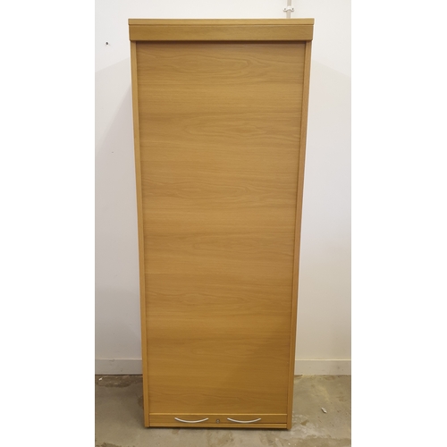 11 - Light oak tambour fronted cabinet 205 80 50 cm.