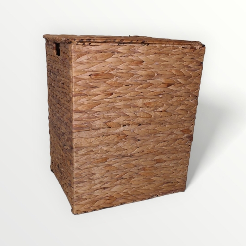 181 - A raffia laundry basket.