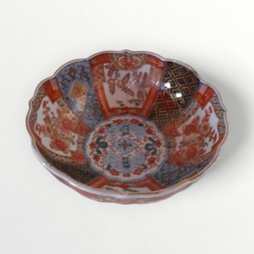 199 - Japanese Imari porcelain 'lotus' bowl 8½ cm high, together with a Japanese 'woodblock' design tea li... 