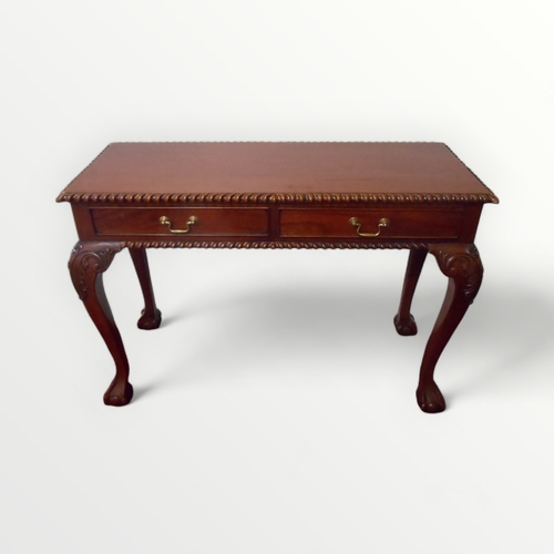 214 - Mahogany finished two drawer side table with fancy carved edges on tall slender legs with 'ball and ... 