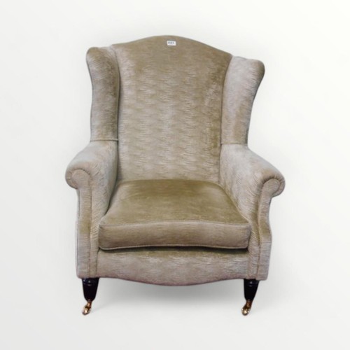 262 - Modern wing back armchair in pale jade 'wave' upholstery. 42cm to seat 100 overall.