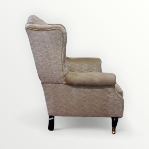 262 - Modern wing back armchair in pale jade 'wave' upholstery. 42cm to seat 100 overall.