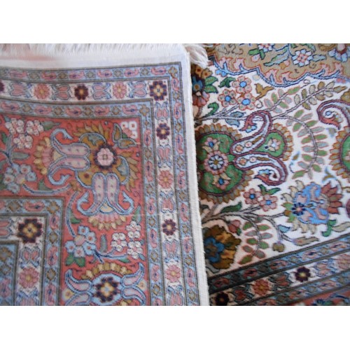 276 - A fine knotted silk rug having stylised floral central field within multi guard boarders. 121 x  184... 