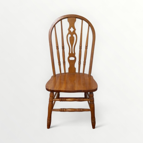 261 - A set of four 'hoop and stick' backed single chairs with solid seats. 108cm